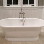 Tub Surrounded by Beadboard Wainscoting