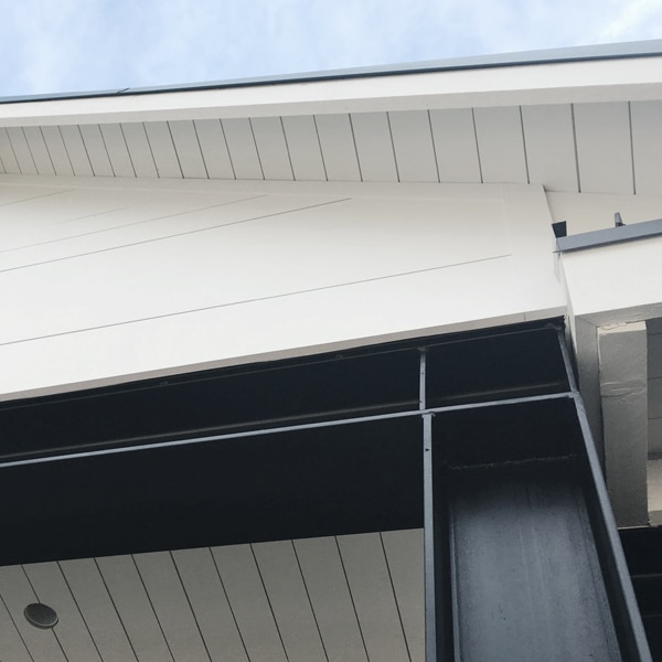 Shiplap soffit with black steel beam column and support