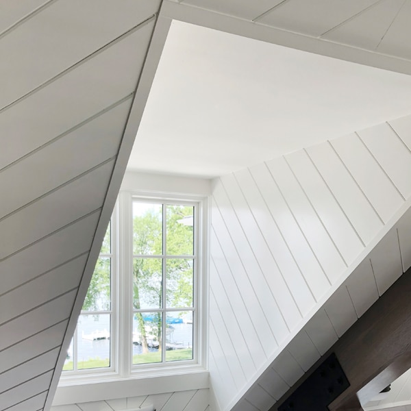 Vgroove boards cover the walls going into a dormered window, installed at angle