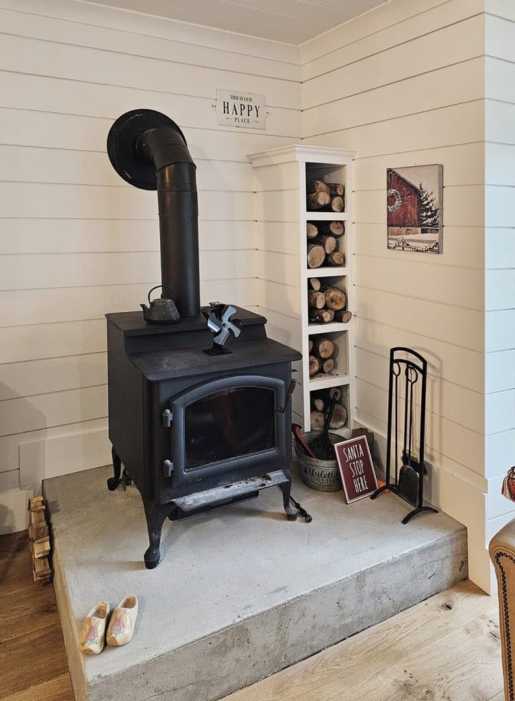 Wood Stove with shiplap surround and built in storage