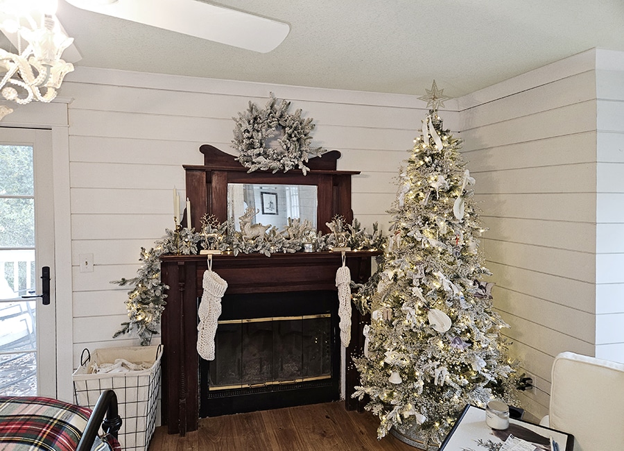 Vintage mantel with Christmas tree against a WindsorONE shiplap wall.