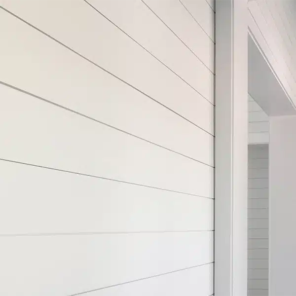 Closeup of hallway wall featuring shiplap