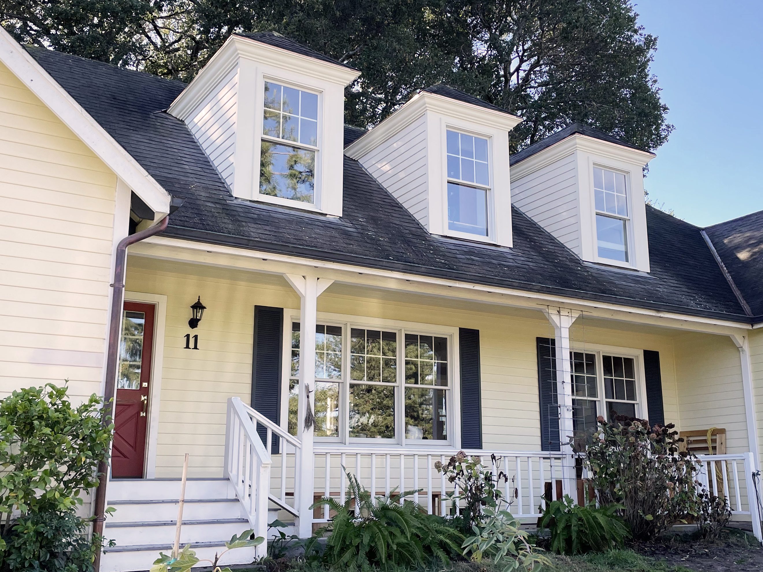 After picture with new dormers that enhance the curb appeal of the home
