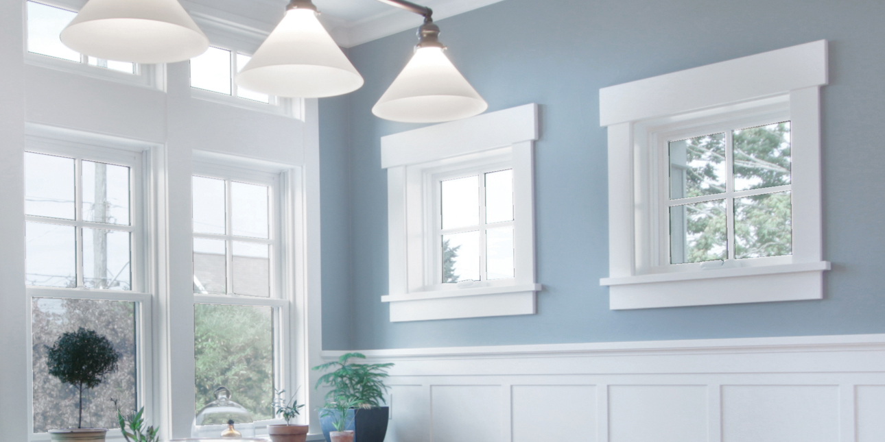 Blue kitchen with white flatstock bungalow trim