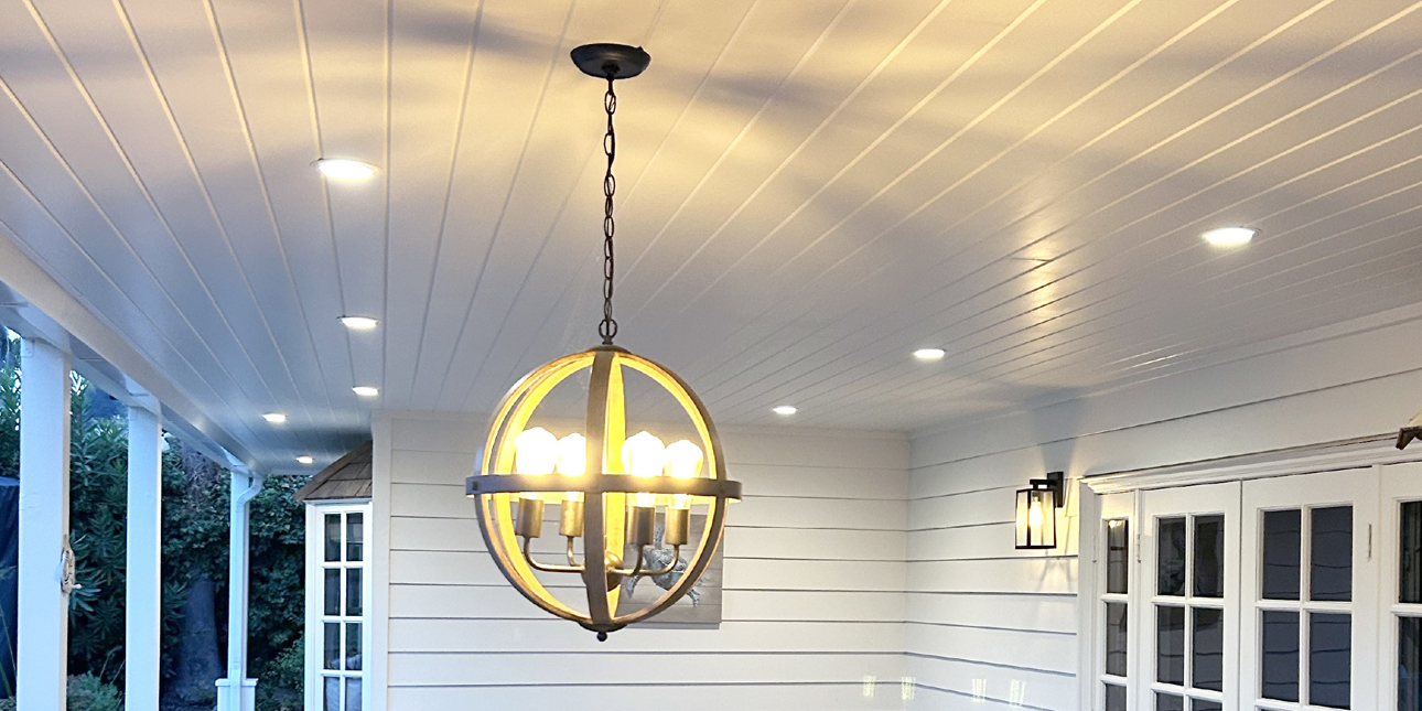 V-groove tongue and groove porch with round chandelier light exterior
