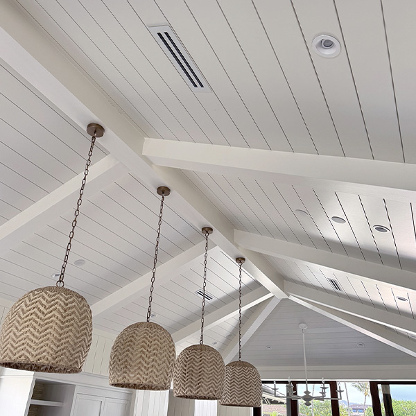 Shiplap ceiling with 4 hanging wicker lamps