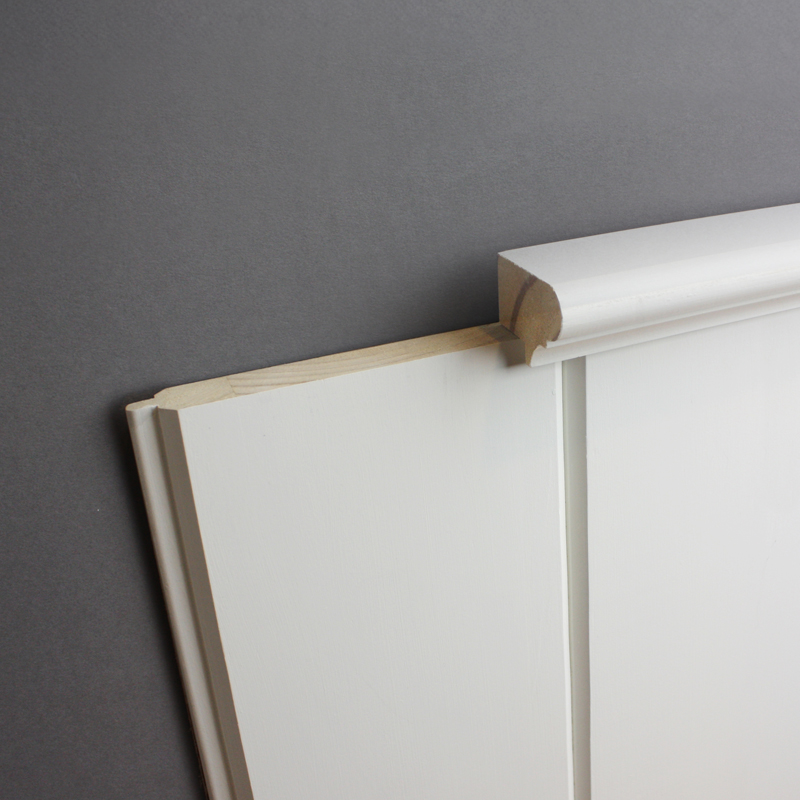 Detail of v-groove tongue and groove boards with wainscot cap
