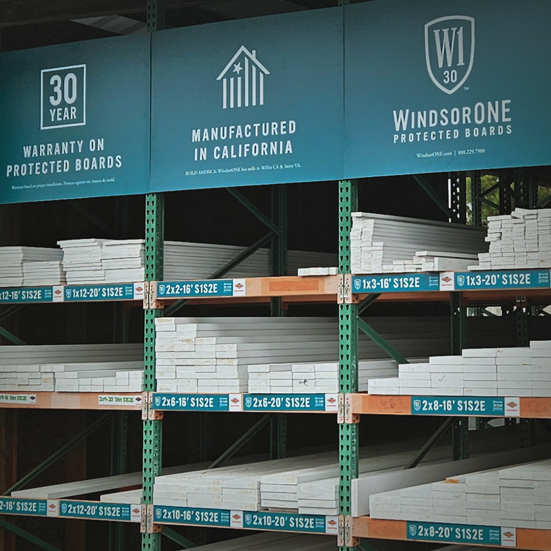 Lumberyard bins full of WindsorONE boards and signage