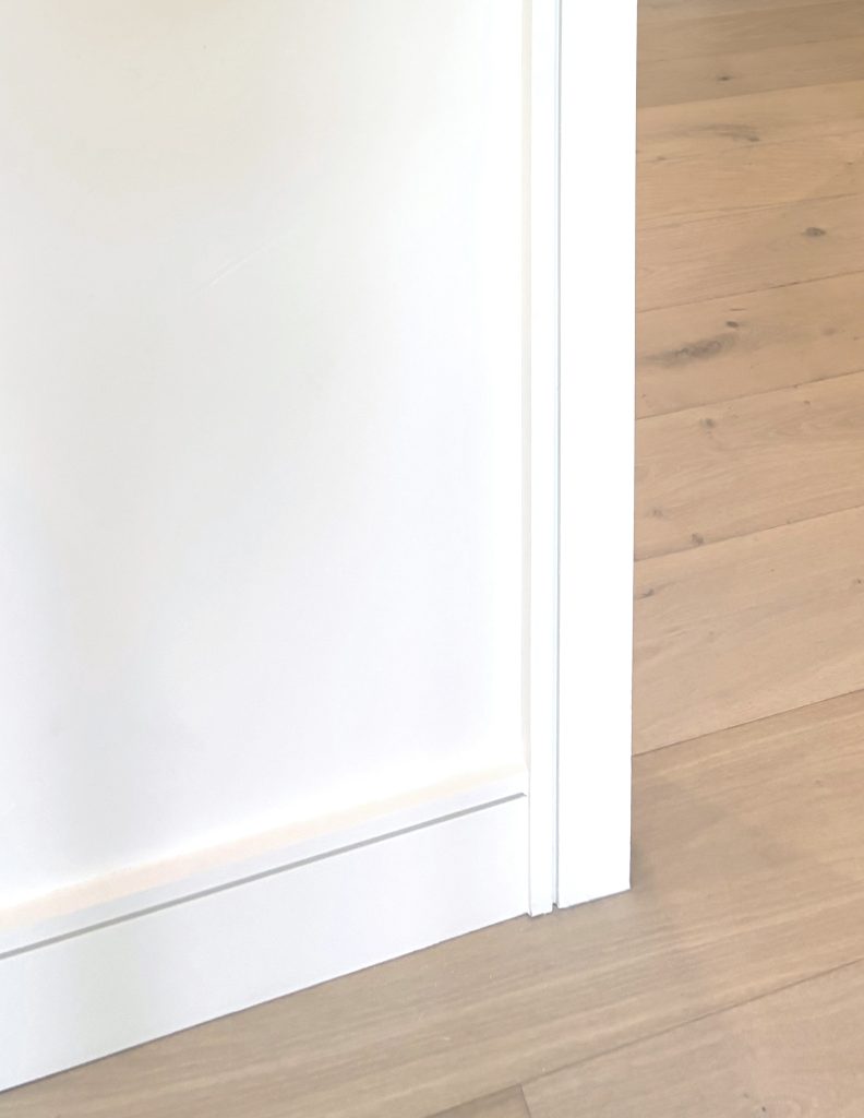 detail of casing and base with custom detail groove flat stock trim boards