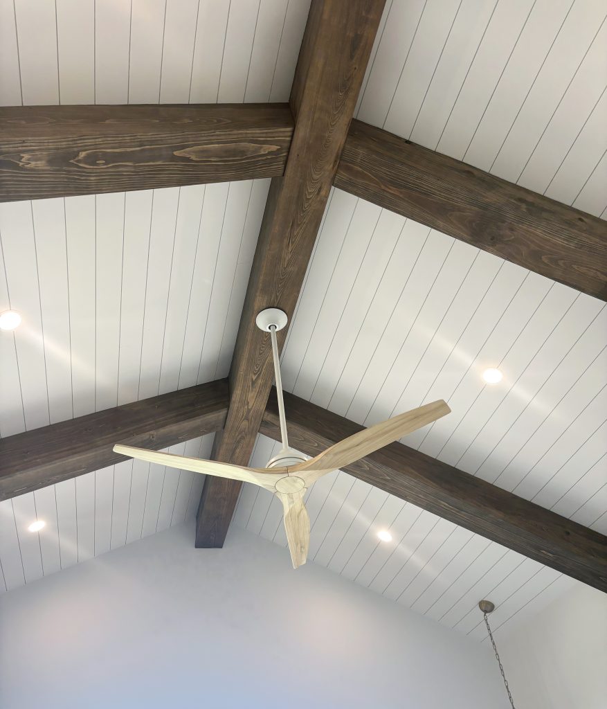 Shiplap ceiling with rustic wood beams